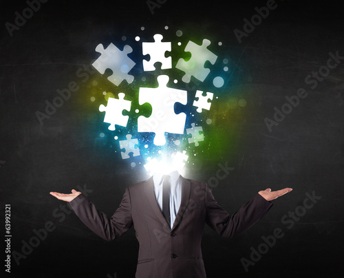 Character in suit with puzzle head concept