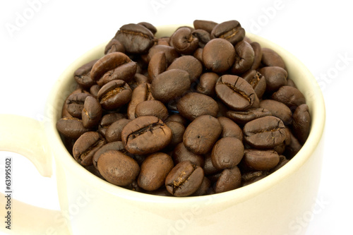Coffee cup with coffee beans on white