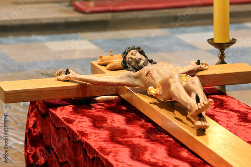 Wooden figure of Jesus crucified, in the church during Easter photo