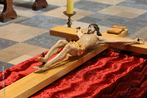 Wooden figure of Jesus crucified, in the church during Easter photo