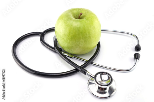 Green apple with stethoscope isolated on white background