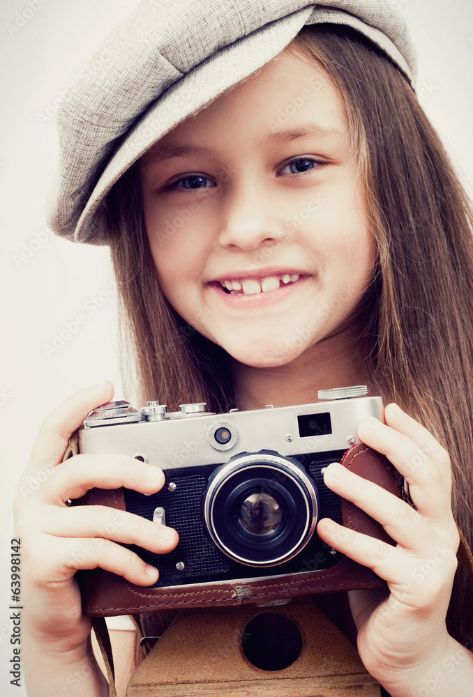 child and a photo camera