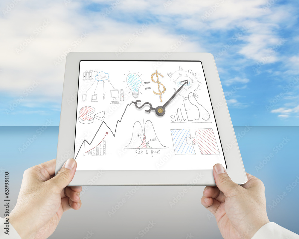 Hand holding tablet with business concept doodles and clock hand