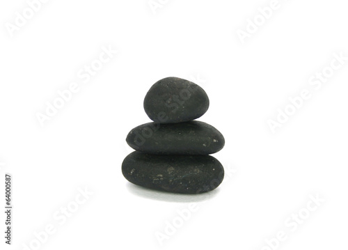 Stack of colored pebble stones on white background
