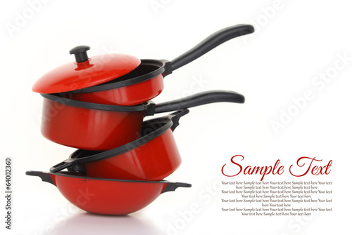 Red cookware set on white background photo