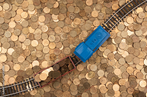 coins background and toy train