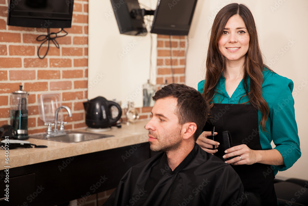 Fotografie Cute hairstylist at work