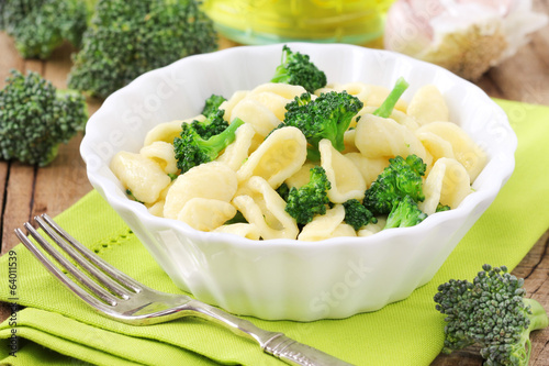 Orecchiette with broccoli in a white plate photo