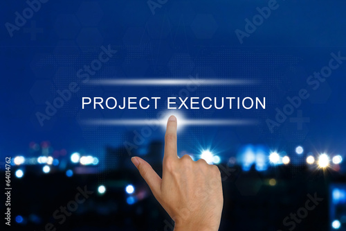 hand pushing project execution button on touch screen
