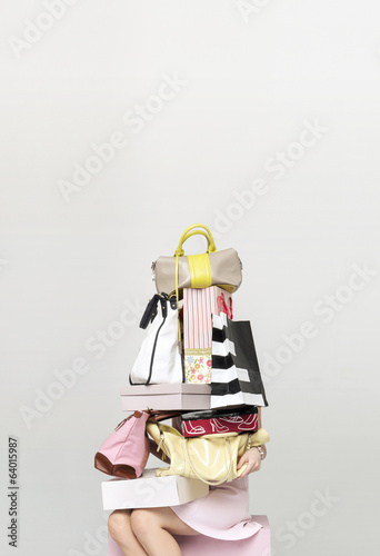 Young woman buying plenty of bags