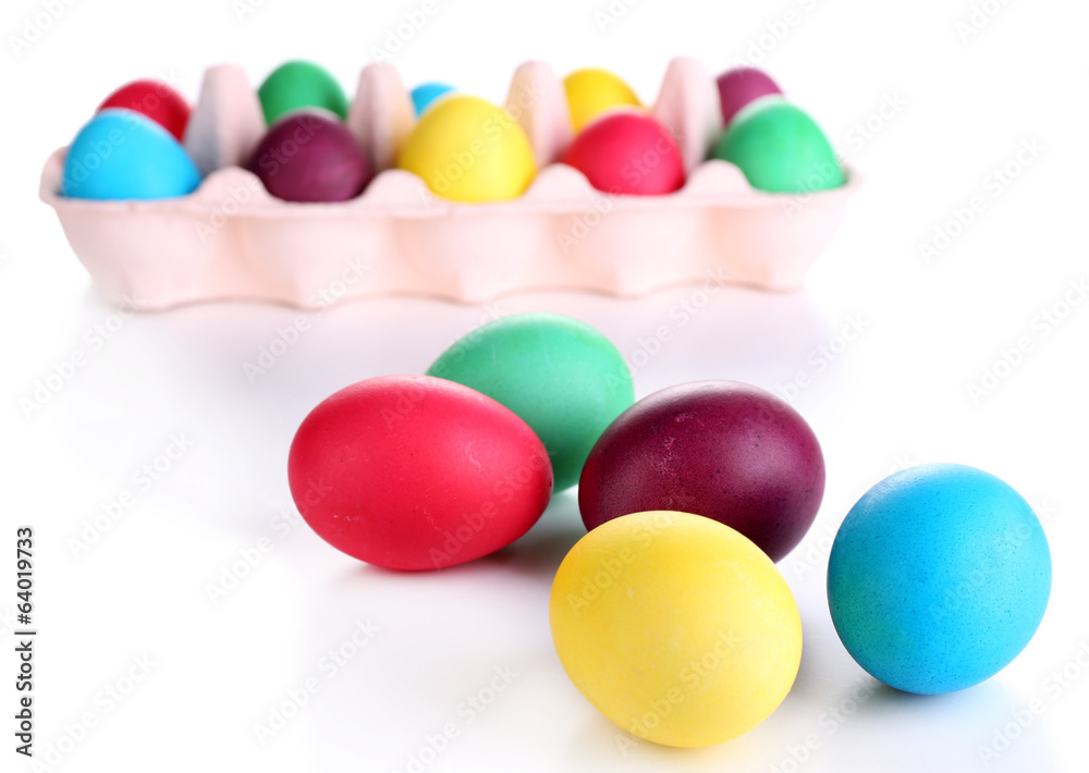 Colorful Easter eggs in tray isolated on white Colorful Easter eggs in tray isolated on white
