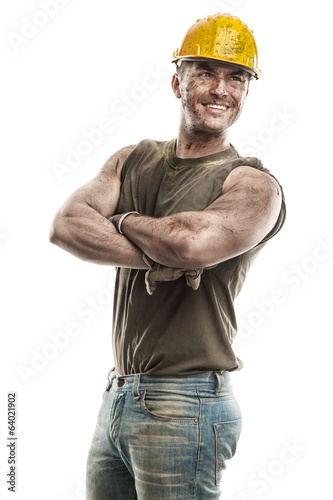 Fotografie portrait of dirty worker with helmet crossed arms