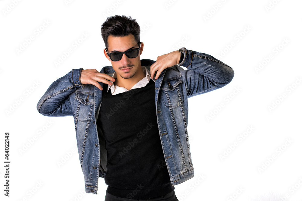 Hip, trendy young man with sunglasses and denim jacket Hip, trendy young man with sunglasses and denim jacket