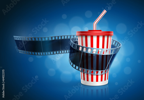 Camera film roll and cardboard cup with a straw.