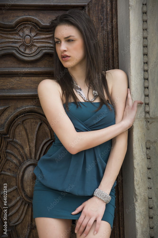 Fototapeta premium Pretty brunette girl outdoors with elegant dress
