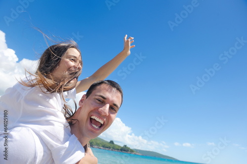 happy couple have fun on the beach