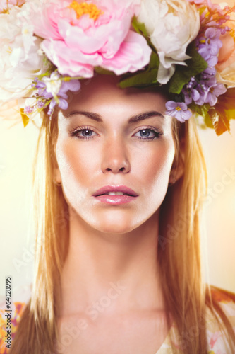 Beauty portrait of a woman with flowers in her hair