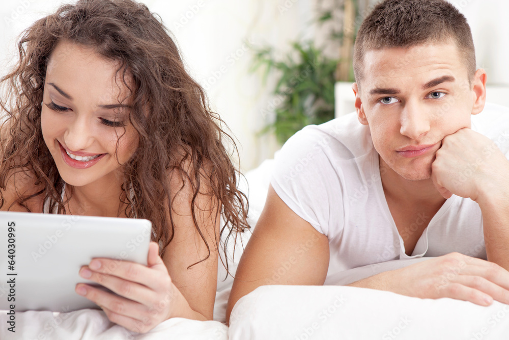 The man was angry when a woman surfs with ipad The man was angry when a woman surfs with ipad