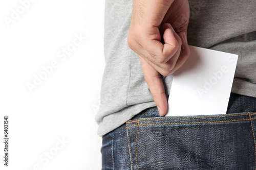 Closeup man pulling a card on his back pocket photo