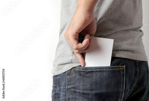 Closeup man pulling a card on his back pocket