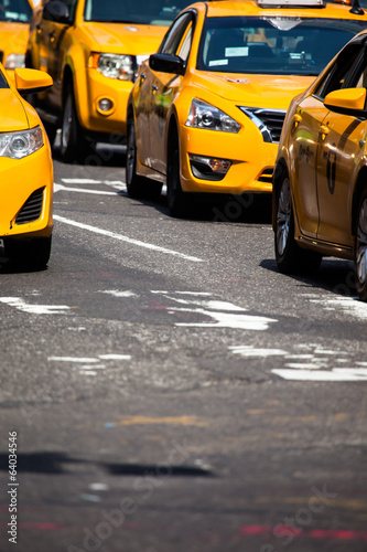 Yellow cab speeds through Times Square in New York, NY, USA.
