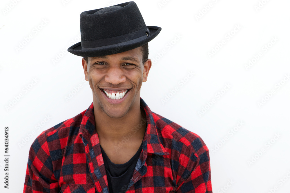 Cool young man smiling with hat Cool young man smiling with hat