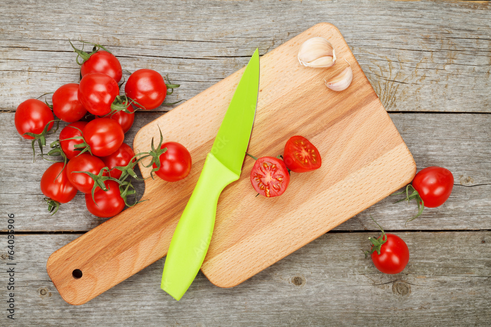Cherry tomatoes on wooden table Cherry tomatoes on wooden table