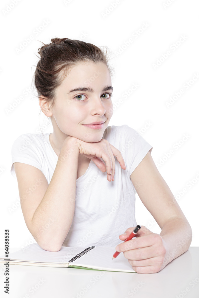 smiling female teenager with blank note book sitting at a table, smiling female teenager with blank note book sitting at a table,