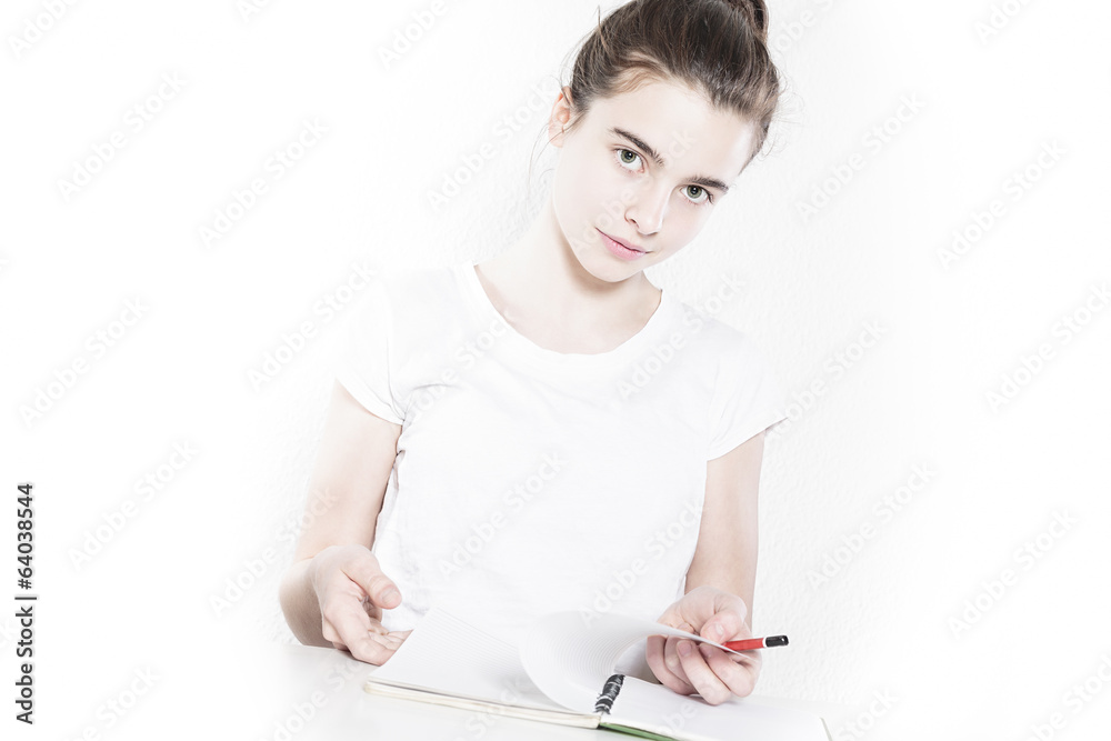 teenager school girl browsing in a blank diary, isolated on whi teenager school girl browsing in a blank diary, isolated on whi