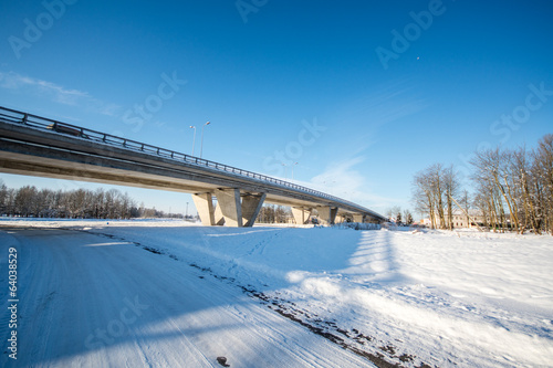 Bridge over railroad. Winter landscape. © nikwaller