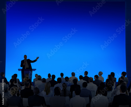 Group Of Business People Listening To A Speech