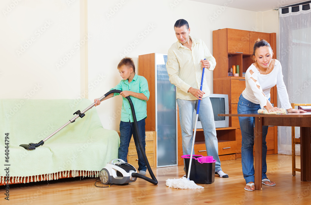  couple with teenage son doing house cleaning