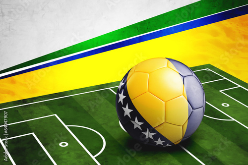 Soccer ball with Bosnia and Herzegovina flag on pitch