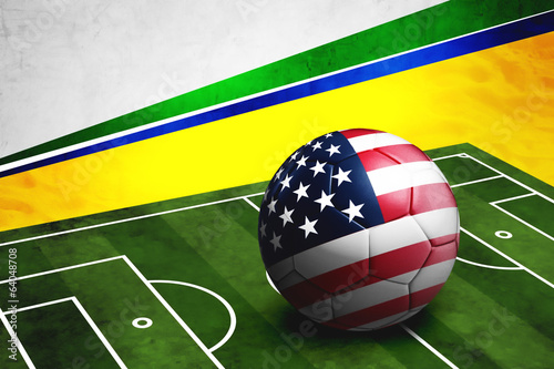 Soccer ball with USA flag on pitch