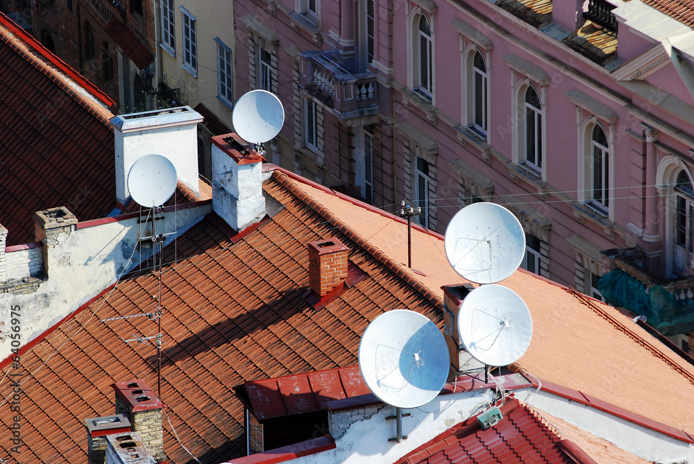 Satellite dish on the roof of a house with clipping paths