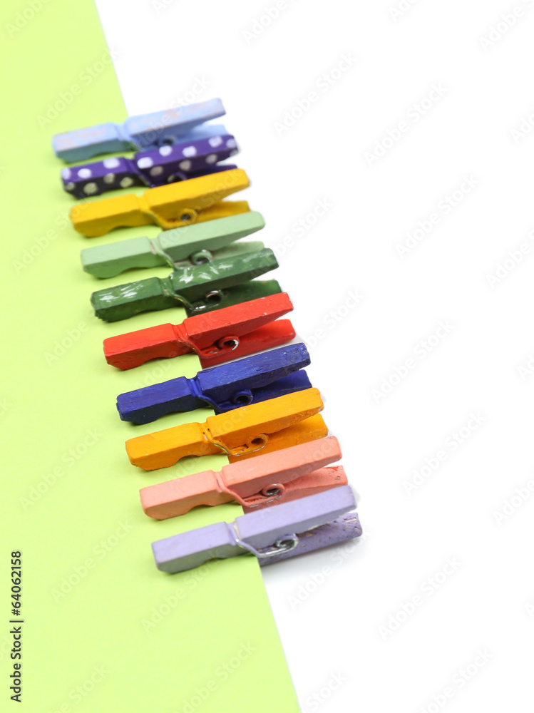 Fototapeta premium Abstract background with colorful wooden pins and paper
