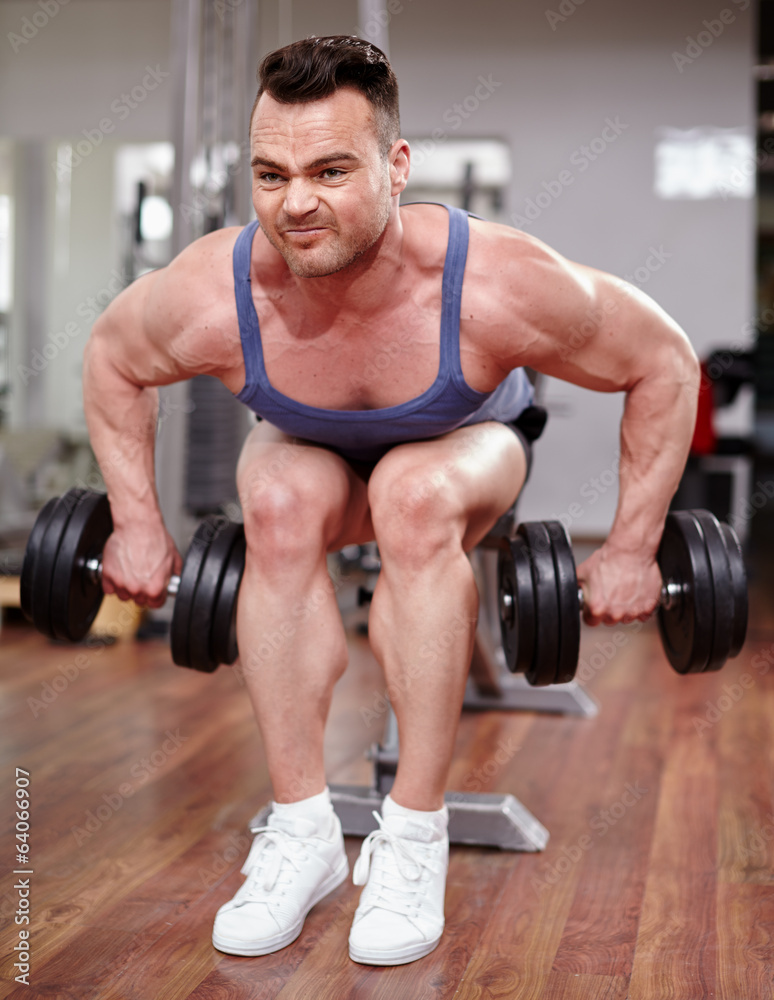Man working with dumbbells Man working with dumbbells