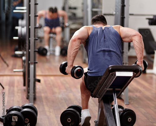 Man working out in front of the mirror