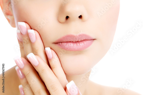 Part of female face and hands, white background, copyspace