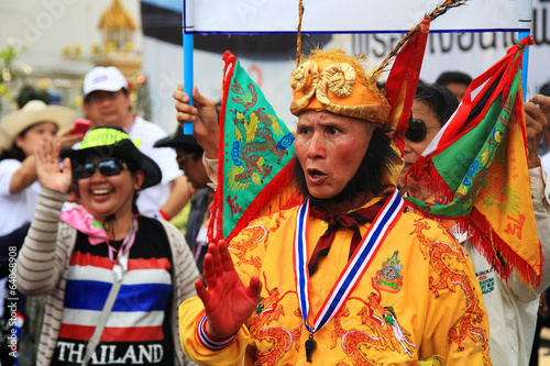 Thai protestor dressing Chinese monkey god suit photo