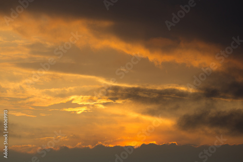 Sunset in the ocean with clouds