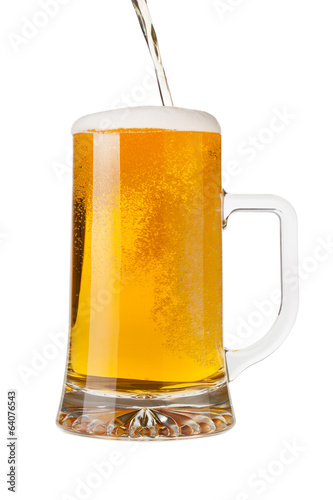 Pouring a pint of sparkling beer isolated on white background