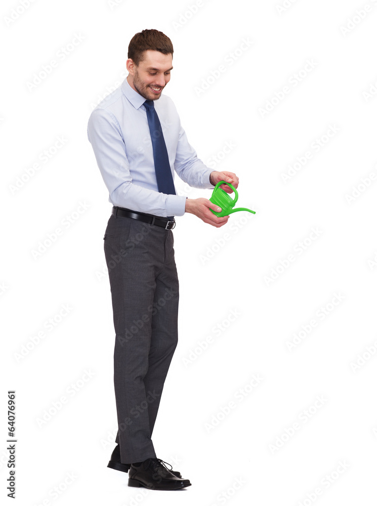 handsome buisnessman with green watering can handsome buisnessman with green watering can