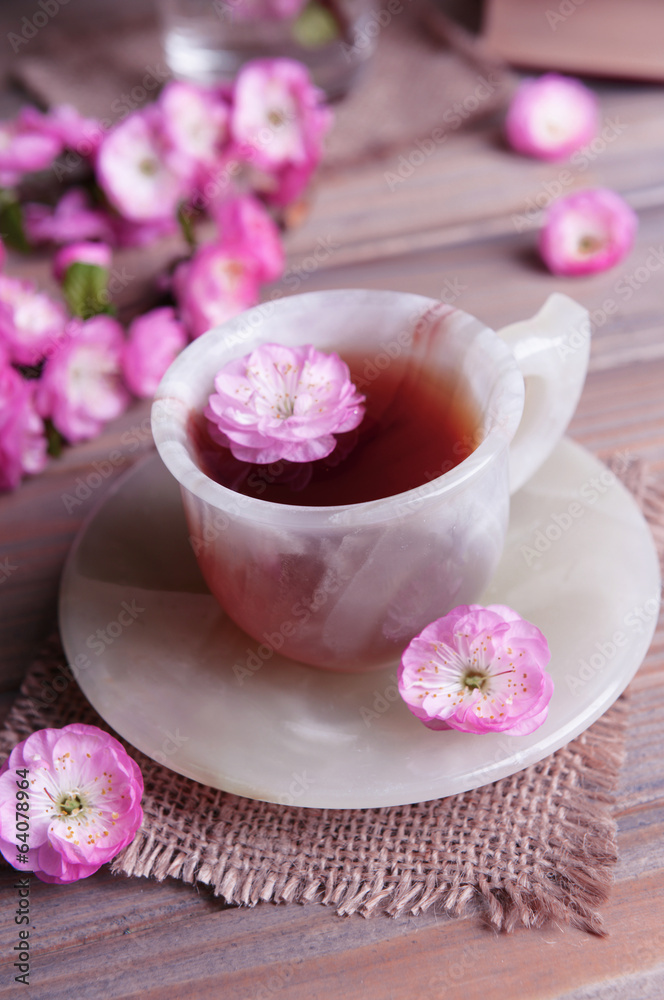 Beautiful fruit blossom with cup of tea Beautiful fruit blossom with cup of tea