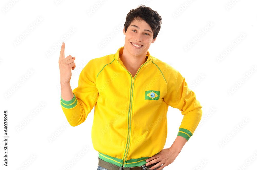 Brazilian man pointing up.Happy football fan with sport blouse. Brazilian man pointing up.Happy football fan with sport blouse.