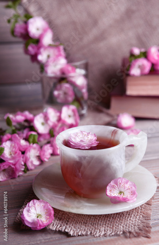 Beautiful fruit blossom with cup of tea