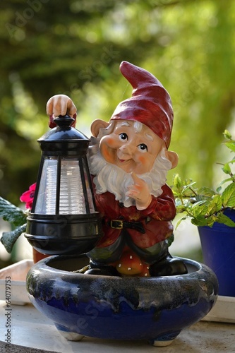 A garden dwarf with solar lamp