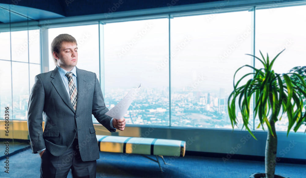Businessman staying infront of city view