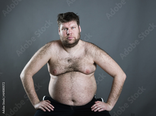Fat man isolated on gray background