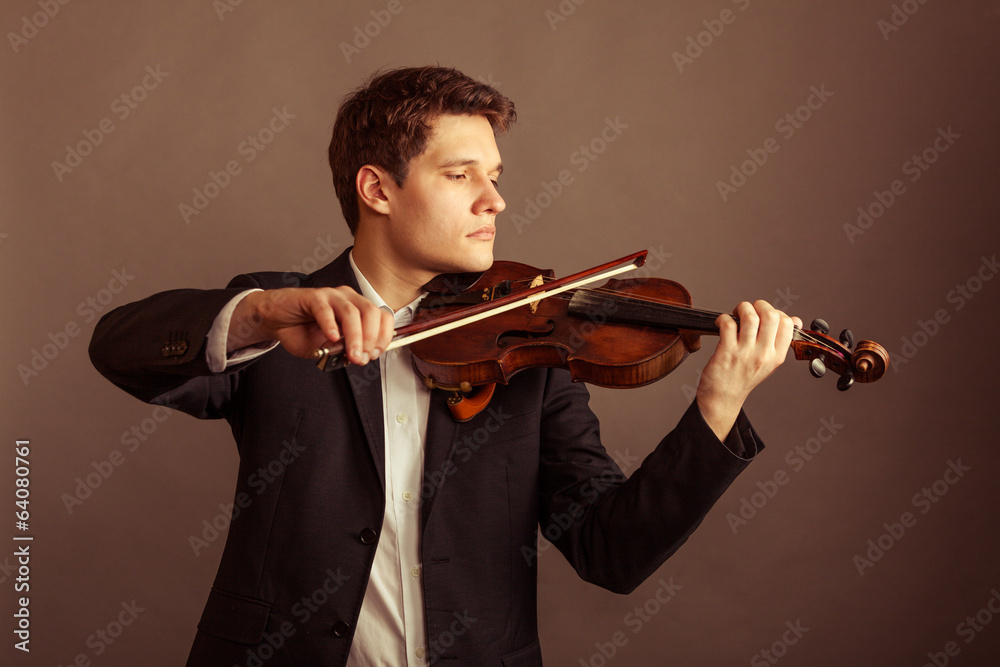 Man violinist playing violin. Classical music art Man violinist playing violin. Classical music art